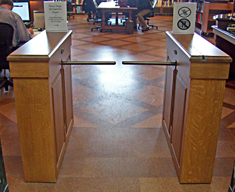 Twin-Arm ADA Linear in custom oak cabinet for library.
